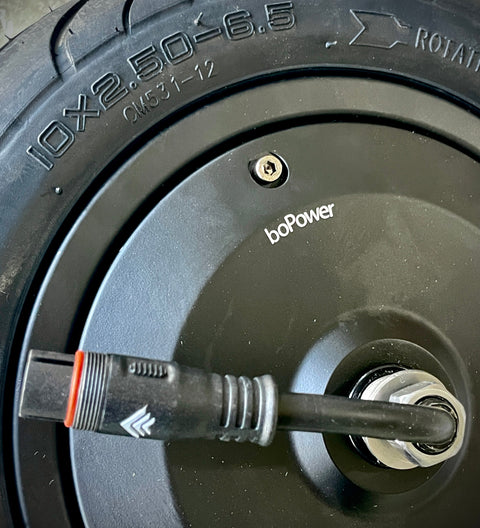 Close-up of a wheel with 'bogPower' branding and tire specifications.