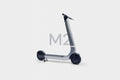 Silver scooter with 'M2' text on a white background