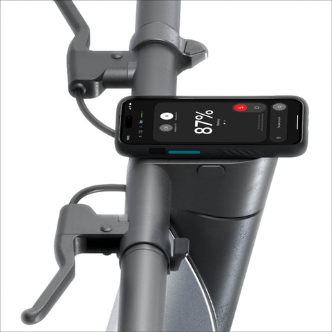 Phone mounted on a bicycle handlebar displaying battery percentage
